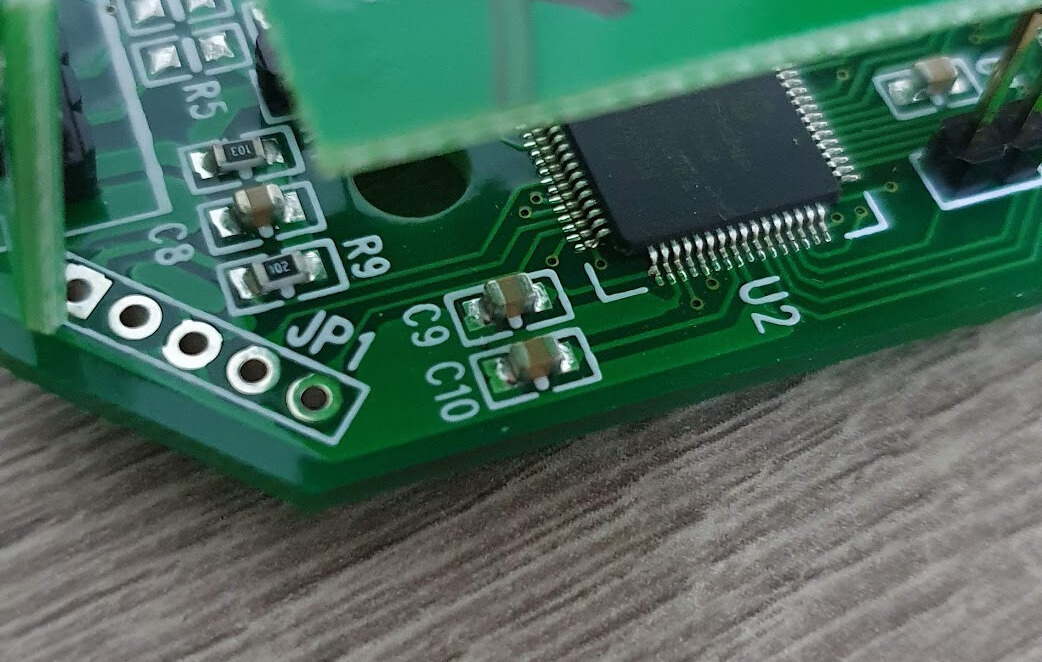 The 5-pin ICSP header (MCLR, VDD, GND, PGED, PGEC)