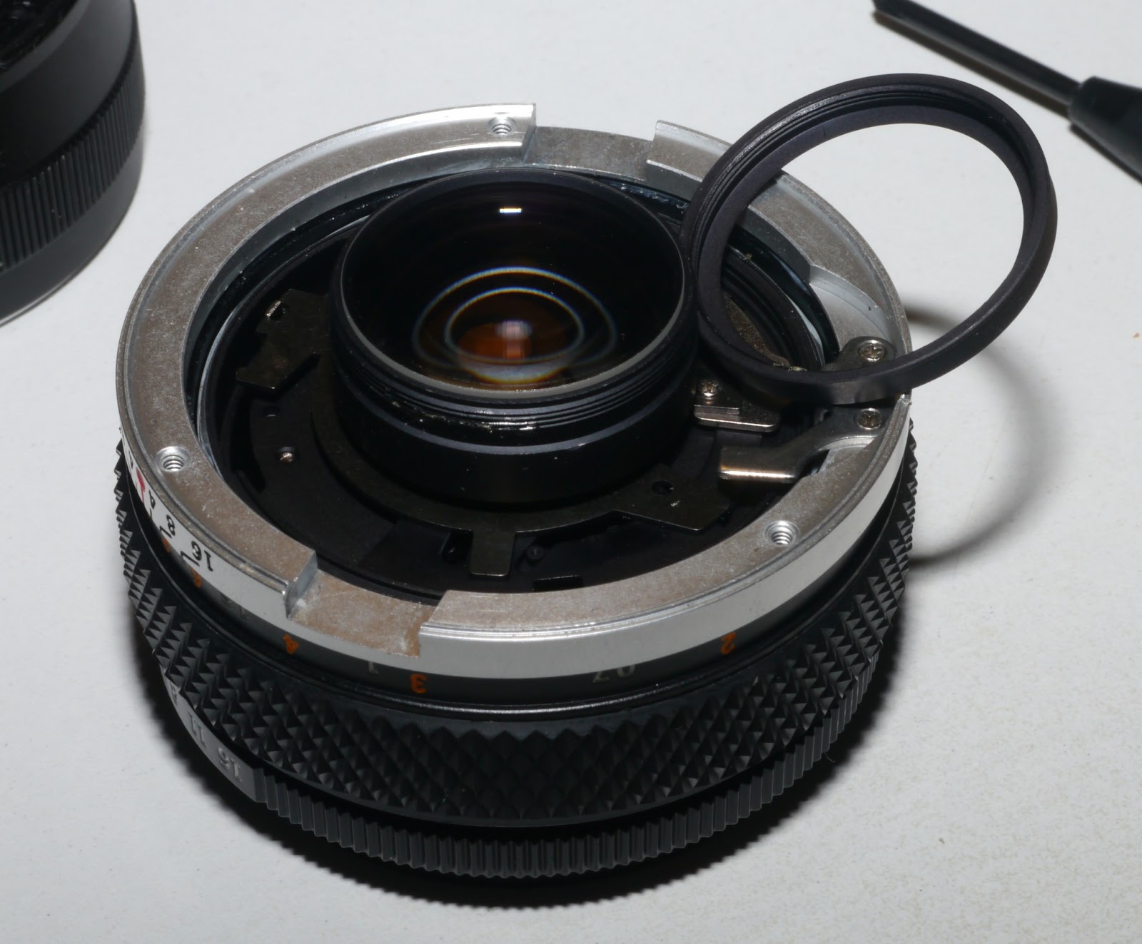 Metal ring removed, exposing the rear lens element