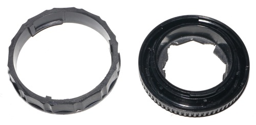 Left: Olympus OM lens cap. The flat part is cut off with a saw. Right: Micro Four Third body cap, the hole was (painfully) open with a cutter, then using a saw.